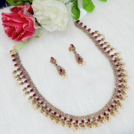 Gorgeous AD and ruby stones Long necklace with matching earrings.