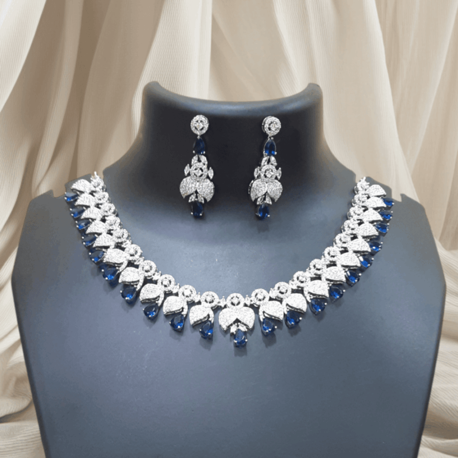 Elegant and Dazzling CZ American Diamond Studded Sapphire Blue Necklace Set with Earrings (Copy)